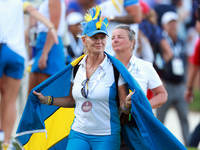 GAINESVILLE, VIRGINIA - SEPTEMBER 13:  A guest of Team Europe wearing spirit wear walks off of the 14th green at the conclusion of the group...