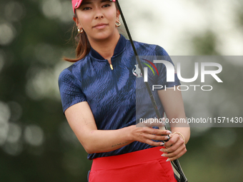 GAINESVILLE, VIRGINIA - SEPTEMBER 13: Alison Lee of the United States reacts to her putt on the third green during Fourball Matches on Day O...