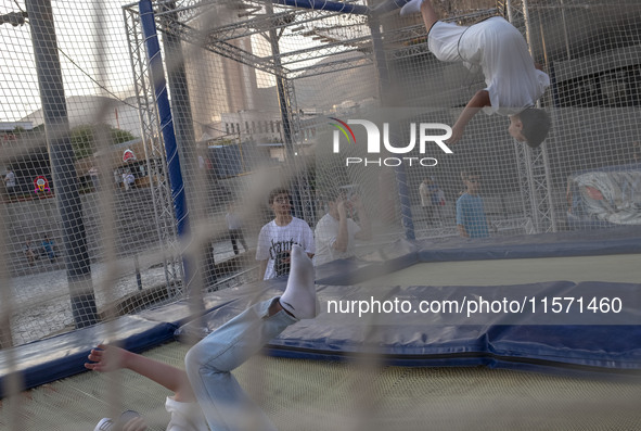 Iranian teenagers play at Adrenaline Park in Tehran, Iran, on September 13, 2024. Amir Badri, an Iranian stuntman and award winner of the Sc...