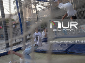 Iranian teenagers play at Adrenaline Park in Tehran, Iran, on September 13, 2024. Amir Badri, an Iranian stuntman and award winner of the Sc...