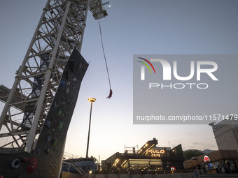 A young Iranian woman performs a bungee jump from a 40-meter rig at Adrenaline Park in Tehran, Iran, on September 13, 2024. Adrenaline Park...