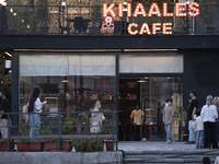 Iranian youths stand outside a cafe at Adrenaline Park in Tehran, Iran, on September 13, 2024. Amir Badri, an Iranian stuntman and award win...