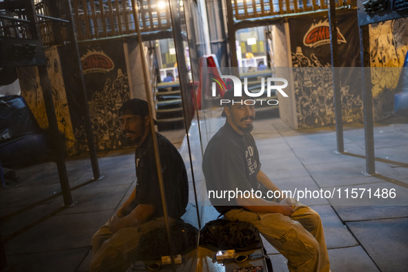 A young Iranian man smiles while looking at the camera as he sits at Adrenaline Park in Tehran, Iran, on September 13, 2024. Amir Badri, an...