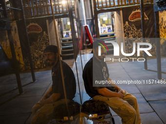 A young Iranian man smiles while looking at the camera as he sits at Adrenaline Park in Tehran, Iran, on September 13, 2024. Amir Badri, an...