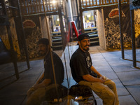 A young Iranian man smiles while looking at the camera as he sits at Adrenaline Park in Tehran, Iran, on September 13, 2024. Amir Badri, an...