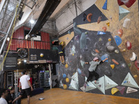 Two young Iranian rock climbers climb a wall at Adrenaline Park in Tehran, Iran, on September 13, 2024. Amir Badri, an Iranian stuntman and...