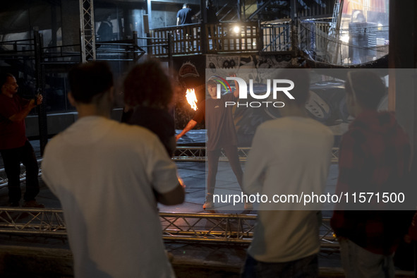 A young Iranian woman performs with fire at Adrenaline Park in Tehran, Iran, on September 13, 2024. Adrenaline Park is founded by Amir Badri...