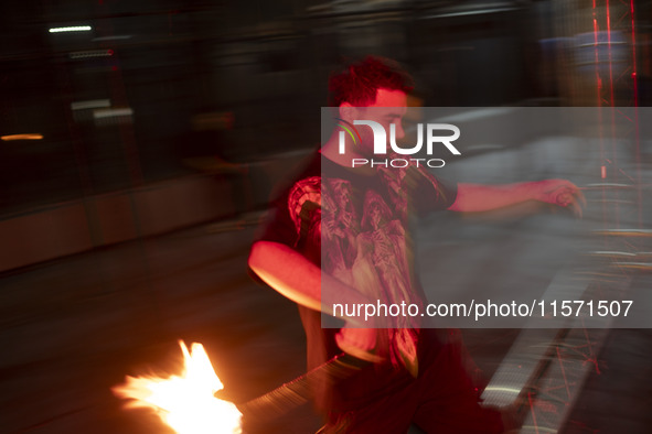 A young Iranian man performs with fire at Adrenaline Park in Tehran, Iran, on September 13, 2024. Adrenaline Park is founded by Amir Badri,...