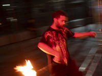 A young Iranian man performs with fire at Adrenaline Park in Tehran, Iran, on September 13, 2024. Adrenaline Park is founded by Amir Badri,...