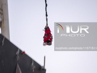 Two young Iranian women perform a bungee jump from a 40-meter rig at Adrenaline Park in Tehran, Iran, on September 13, 2024. Adrenaline Park...