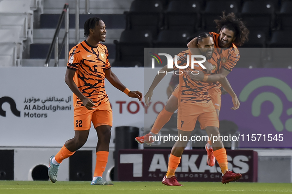 Kenji Joel (C) of Umm Salal SC celebrates after scoring a goal during the Ooredoo Qatar Stars League 24/25 match between Al-Sadd SC and Umm...