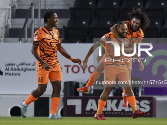 Kenji Joel (C) of Umm Salal SC celebrates after scoring a goal during the Ooredoo Qatar Stars League 24/25 match between Al-Sadd SC and Umm...