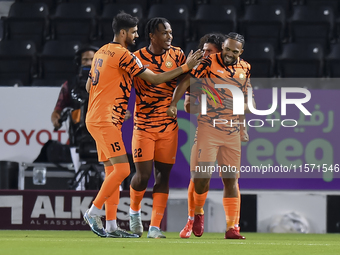 Kenji Joel (R) of Umm Salal SC celebrates after scoring a goal during the Ooredoo Qatar Stars League 24/25 match between Al-Sadd SC and Umm...