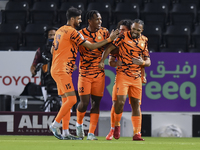 Kenji Joel (R) of Umm Salal SC celebrates after scoring a goal during the Ooredoo Qatar Stars League 24/25 match between Al-Sadd SC and Umm...