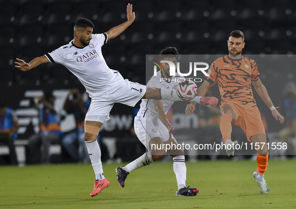 Mohammed Waad Albayati (L) of Al-Sadd SC battles for the ball with Antonio Mance (R) of Umm Salal SC during the Ooredoo Qatar Stars League 2...