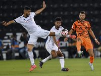 Mohammed Waad Albayati (L) of Al-Sadd SC battles for the ball with Antonio Mance (R) of Umm Salal SC during the Ooredoo Qatar Stars League 2...