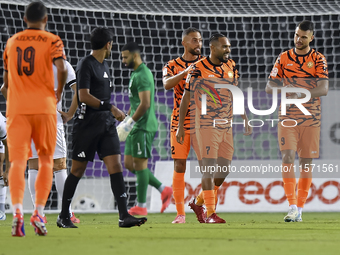 Antonio Mance (R) of Umm Salal SC celebrates after scoring a goal during the Ooredoo Qatar Stars League 24/25 match between Al-Sadd SC and U...