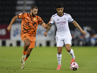 Paulo Silva (R) of Al-Sadd SC and Oussama Tannane (L) of Umm Salal SC are in action during the Ooredoo Qatar Stars League 24/25 match betwee...