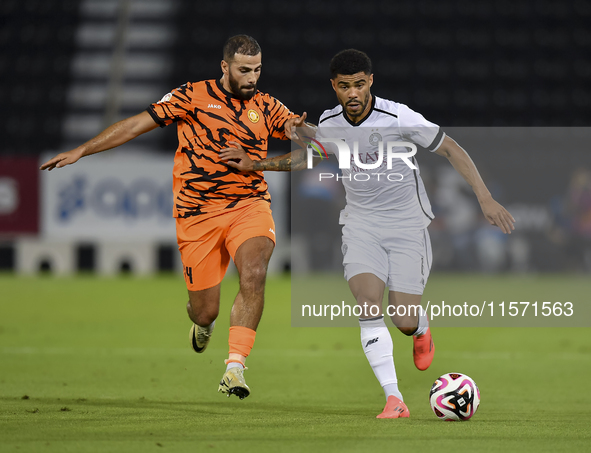 Paulo Silva (R) of Al-Sadd SC and Oussama Tannane (L) of Umm Salal SC are in action during the Ooredoo Qatar Stars League 24/25 match betwee...