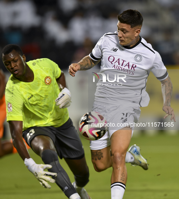 Cristo Ramon Gonzalez Perez (R) of Al-Sadd SC and Landing Badji (L) of Umm Salal SC are in action during the Ooredoo Qatar Stars League 24/2...