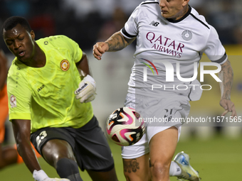 Cristo Ramon Gonzalez Perez (R) of Al-Sadd SC and Landing Badji (L) of Umm Salal SC are in action during the Ooredoo Qatar Stars League 24/2...