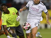 Cristo Ramon Gonzalez Perez (R) of Al-Sadd SC and Landing Badji (L) of Umm Salal SC are in action during the Ooredoo Qatar Stars League 24/2...