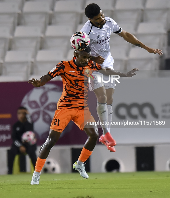 Paulo Silva (R) of Al-Sadd SC and Khalaf Saad Khalifa (L) of Umm Salal SC are in action during the Ooredoo Qatar Stars League 24/25 match be...