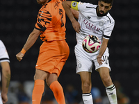 Hasan Khalid Alhaydos (R) of Al-Sadd SC battles for the ball with Omar Yahya Rabah (L) of Umm Salal SC during the Ooredoo Qatar Stars League...