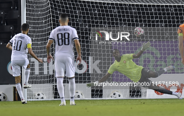 Hasan Khalid Alhaydos of Al Sadd SC takes a penalty to score a goal during the Ooredoo Qatar Stars League 24/25 match between Al-Sadd SC and...