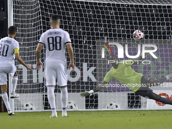 Hasan Khalid Alhaydos of Al Sadd SC takes a penalty to score a goal during the Ooredoo Qatar Stars League 24/25 match between Al-Sadd SC and...