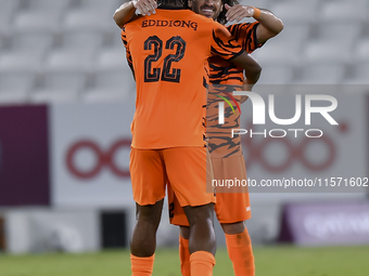 Edidiong Nigerian (L) of Umm Salal SC celebrates after scoring a goal during the Ooredoo Qatar Stars League 24/25 match between Al-Sadd SC a...