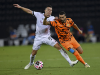 Andres Villa (L) of Al-Sadd SC battles for the ball with Ali Said Al-Muhannadi (R) of Umm Salal SC during the Ooredoo Qatar Stars League 24/...