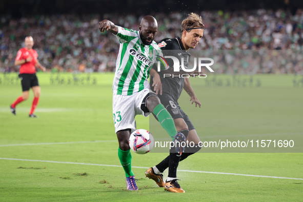 Youssouf Sabaly of Real Betis competes for the ball with Sergio Gonzalez of CD Leganes during the La Liga EA Sports match between Real Betis...