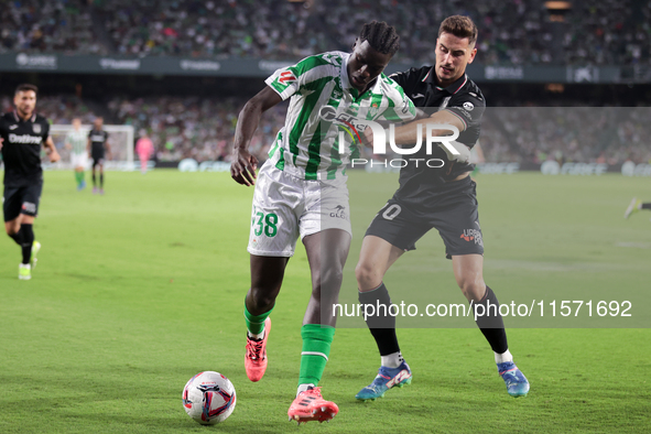 Assane Diao of Real Betis battles for the ball during the La Liga EA Sports match between Real Betis and CD Leganes at Benito Villamarin in...