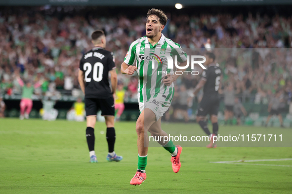 Ez Abde of Real Betis celebrates scoring his team's first goal with his teammates during the La Liga EA Sports match between Real Betis and...