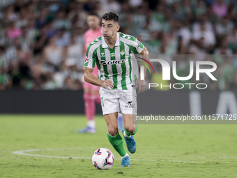 Marc Roca of Real Betis runs with the ball during the La Liga EA Sports match between Real Betis and CD Leganes at Benito Villamarin in Sevi...