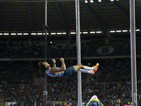 Armand Duplantis of Sweden reacts in the air while he competes in the Men's Pole Vault during the Wanda Diamond League 2024 final event, an...