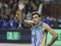 Armand Duplantis of Sweden waves as he competes in the Men's Pole Vault during the Wanda Diamond League 2024 final event, an athletics meeti...