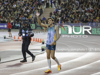 Armand Duplantis of Sweden waves as he competes in the Men's Pole Vault during the Wanda Diamond League 2024 final event, an athletics meeti...