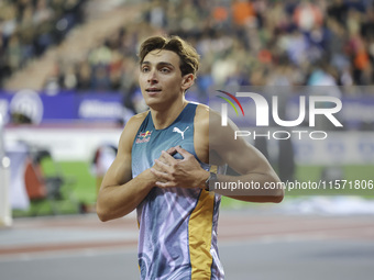 Armand Duplantis of Sweden reacts and celebrates holding his heart as he competes in the Men's Pole Vault during the Wanda Diamond League 20...