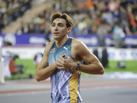 Armand Duplantis of Sweden reacts and celebrates holding his heart as he competes in the Men's Pole Vault during the Wanda Diamond League 20...