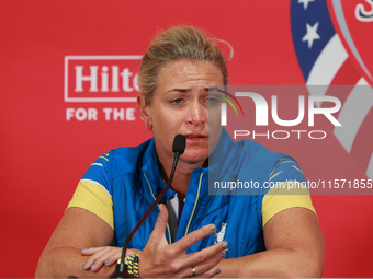 GAINESVILLE, VIRGINIA - SEPTEMBER 13: Captain Suzann Pettersen of of Team Europe speaks to the media during Day One of the Solheim Cup at Ro...