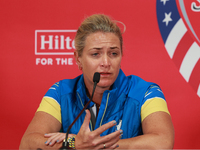 GAINESVILLE, VIRGINIA - SEPTEMBER 13: Captain Suzann Pettersen of of Team Europe speaks to the media during Day One of the Solheim Cup at Ro...