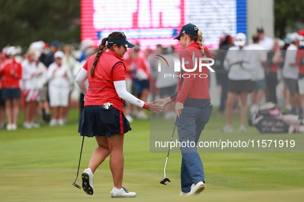 GAINESVILLE, VIRGINIA - SEPTEMBER 13: Lilia Vu of of Team USA celebrates her putt on the third green with teammate Sarah Schmelzel during Fo...