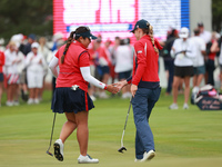 GAINESVILLE, VIRGINIA - SEPTEMBER 13: Lilia Vu of of Team USA celebrates her putt on the third green with teammate Sarah Schmelzel during Fo...