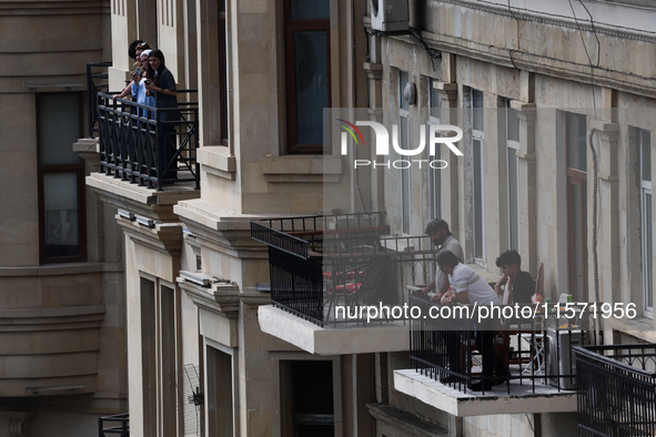 People on balconies during first practice ahead of the Formula 1 Grand Prix of Azerbaijan at Baku City Circuit in Baku, Azerbaijan on Septem...