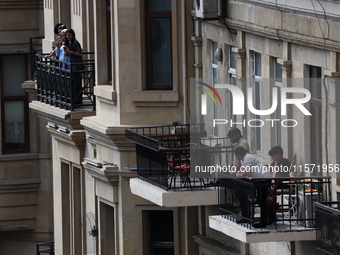 People on balconies during first practice ahead of the Formula 1 Grand Prix of Azerbaijan at Baku City Circuit in Baku, Azerbaijan on Septem...