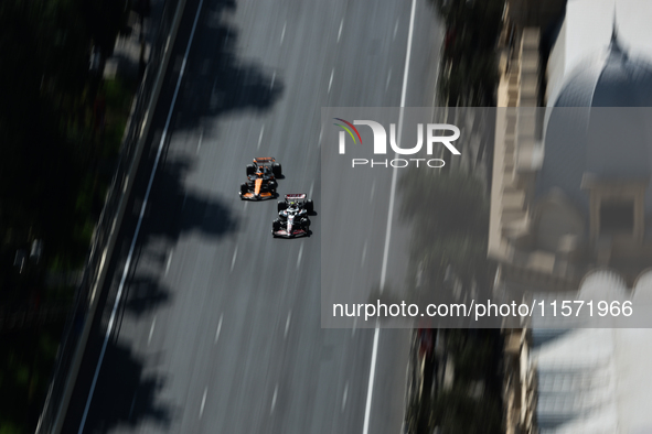 Nico Hulkenberg of Haas and Oscar Piastri of McLaren during first practice ahead of the Formula 1 Grand Prix of Azerbaijan at Baku City Circ...