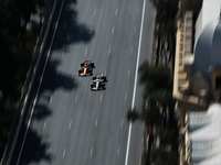 Nico Hulkenberg of Haas and Oscar Piastri of McLaren during first practice ahead of the Formula 1 Grand Prix of Azerbaijan at Baku City Circ...