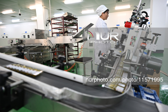 A worker produces diclofenac sodium injection at a pharmaceutical company in Suqian, China, on September 13, 2024. 